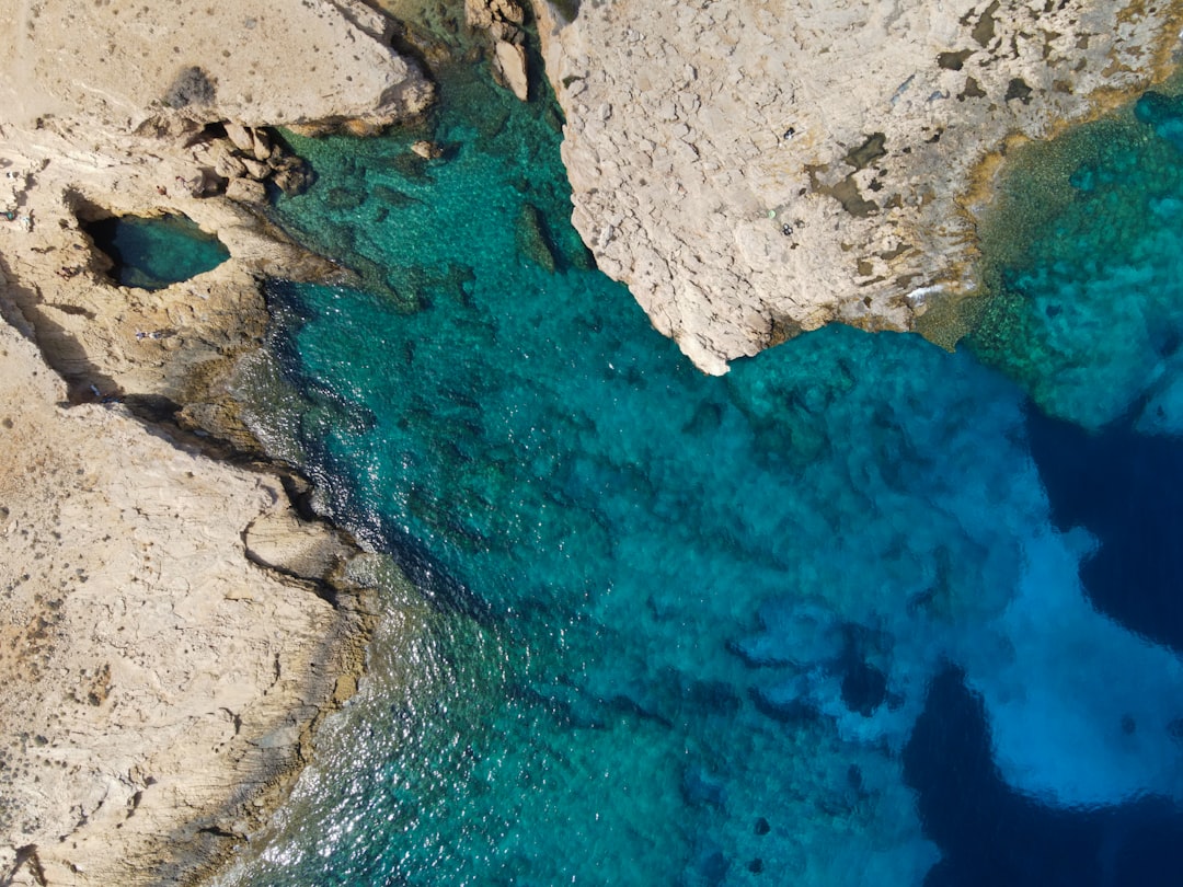 Drone shot taken above a natural swimming pool, located in Ano Koufonisi, Cyclades, Greece.